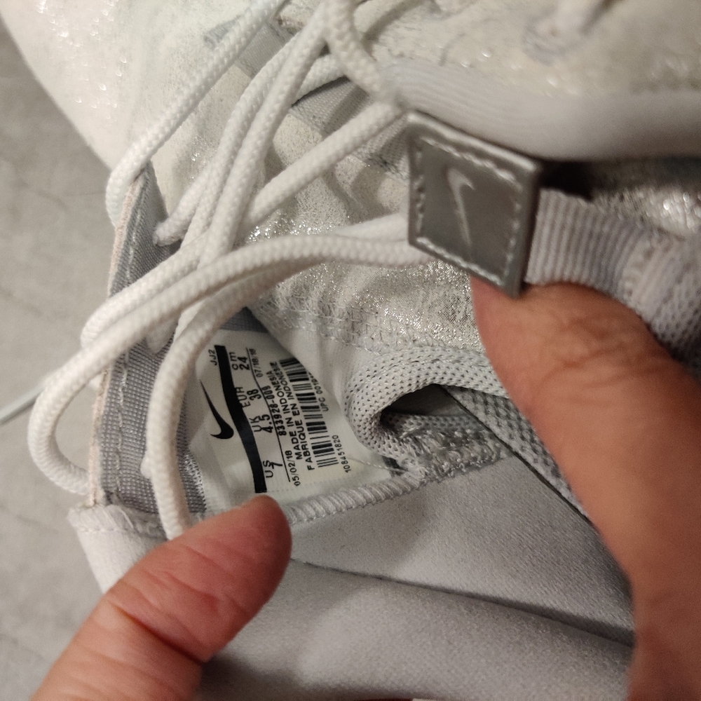 Shiny white Nike sneakers